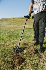 Image showing Person with metal finder on nature