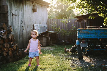 Image showing Child playing in backyard