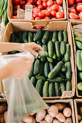 Image showing Crop person buying vegetables