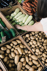 Image showing Crop person buying vegetables