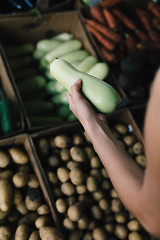 Image showing Crop person buying vegetables