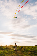 Image showing Girl with kite on nature