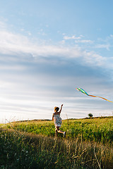 Image showing Anonymous girl with kite