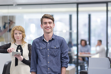 Image showing Business People Working With Tablet in startup office