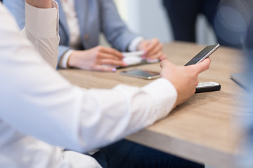 Image showing Young casual businessman using smartphone