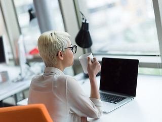 Image showing businesswoman using a laptop in startup office