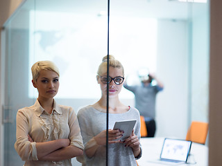 Image showing Pretty Businesswomen Using Tablet In Office Building during conf