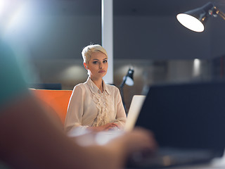 Image showing woman working on laptop in night startup office