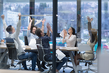 Image showing startup Group of young business people throwing documents