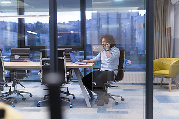 Image showing Young casual businessman using smartphone