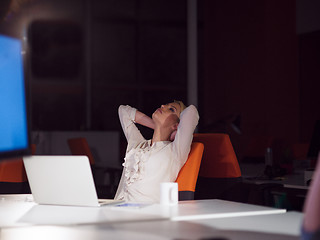 Image showing woman working on laptop in night startup office