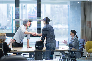 Image showing cloasing the deal in modern office interior