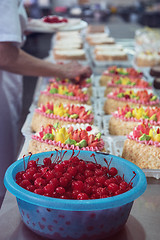 Image showing Bowl of cherry on cake production