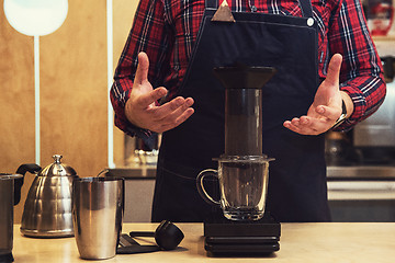 Image showing Barista brewing aeropress coffee