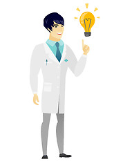 Image showing Doctor pointing at bright idea light bulb.