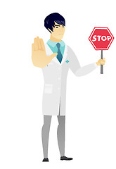 Image showing Asian doctor holding stop road sign.