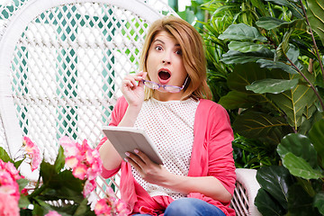 Image showing Beautiful surprised woman with tablet