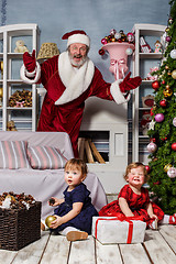 Image showing The two little girls with Santa at studio with christmas decorations