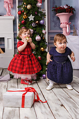 Image showing The two little girl standing at studio with christmas decorations