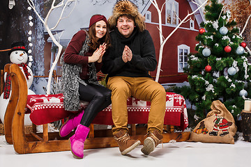 Image showing Happy young couple with Christmasd ecorations tree at home