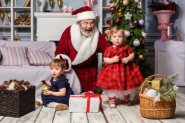 Image showing The two little girls with Santa at studio with christmas decorations