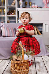 Image showing Little girl standing at studio with christmas decorations