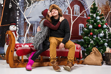 Image showing Happy young couple with Christmasd ecorations tree at home