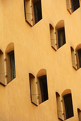 Image showing open mirror shutters on the sunlit wall of the house, Stockholm