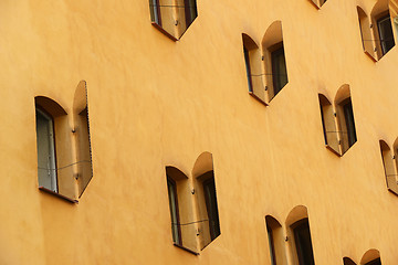 Image showing open mirror shutters on the sunlit wall of the house, Stockholm