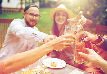 Image showing happy friends with drinks at summer garden party