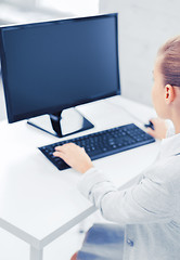 Image showing businesswoman with computer in office