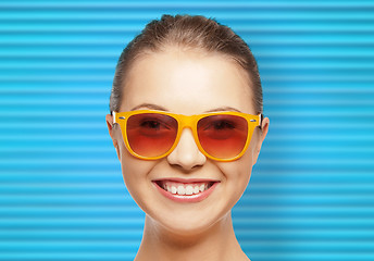 Image showing happy teenage girl or woman face in shades