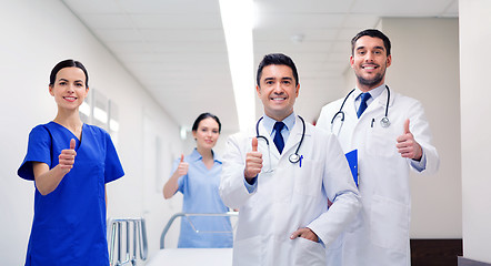 Image showing happy doctors showing thumbs up at hospital