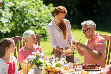 Image showing happy family having dinner or summer garden party