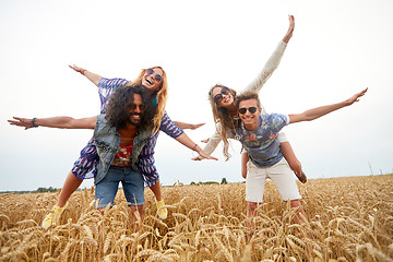 Image showing happy hippie friends having fun on cereal field