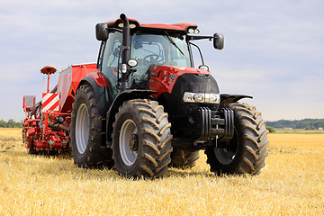 Image showing Red Case IH Tractor and Seeder on Stubble Field