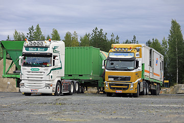 Image showing Trucks Deliver Load on Industrial Site