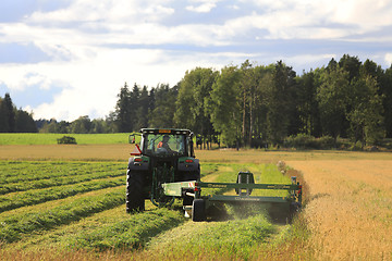 Image showing Modern Hay Cutting in Summer Evening