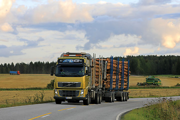 Image showing Volvo FH Logging Truck on Evening Country Road