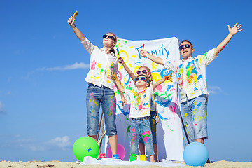 Image showing Happy family playing on the beach at the day time.