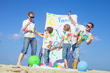 Image showing Happy family playing on the beach at the day time.