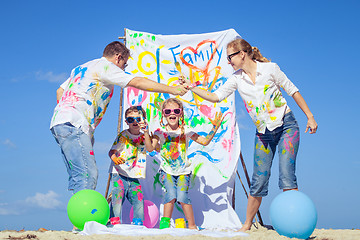 Image showing Happy family playing on the beach at the day time.