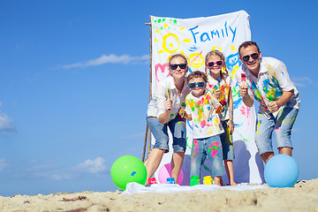 Image showing Happy family playing on the beach at the day time.