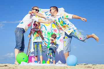 Image showing Happy family playing on the beach at the day time.