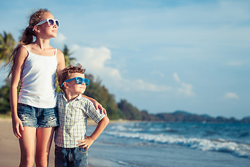 Image showing Happy children playing on the beach at the day time.