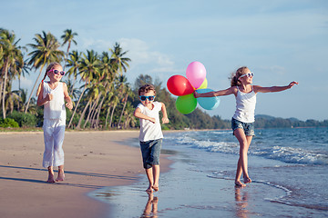 Image showing Happy children playing on the beach at the day time.