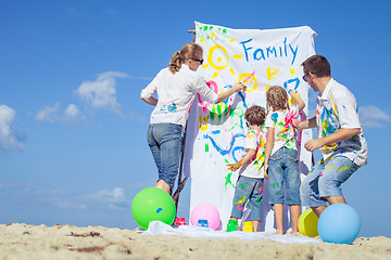 Image showing Happy family playing on the beach at the day time.