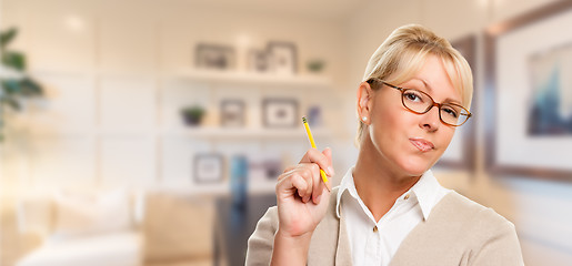 Image showing Beautiful Expressive Student or Businesswoman with Pencil in Off