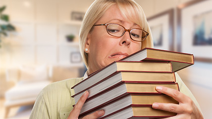 Image showing Beautiful Expressive Student or Businesswoman with Books in Offi