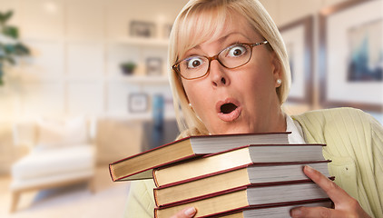 Image showing Beautiful Expressive Student or Businesswoman with Books in Offi